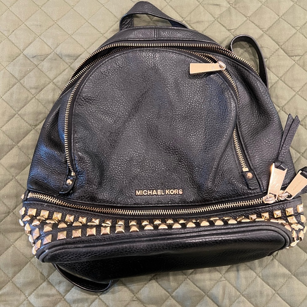 Michael Kors Studded Back Pack. Like new. Leather and studs in good condition.